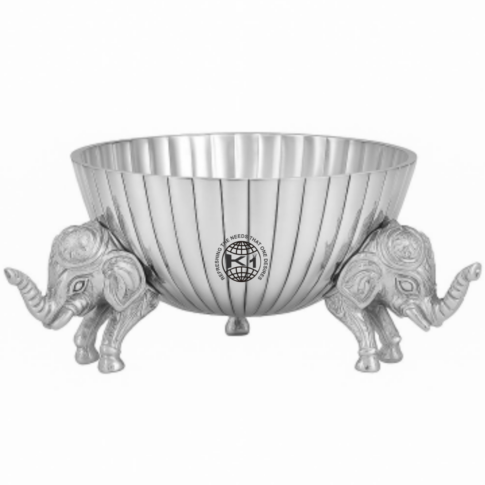 silver-toned metal urli candle with elephant stands. 