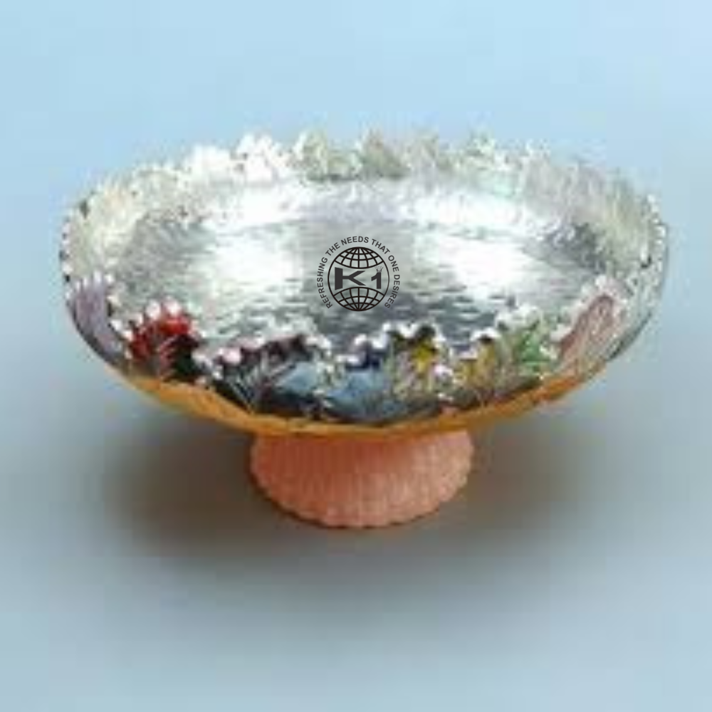 silver-plated metal urli bowl with elephant figure