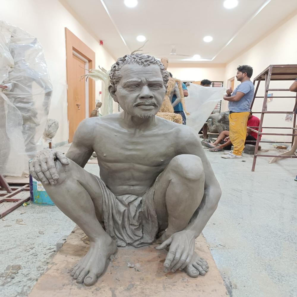 Human figure sitting statue