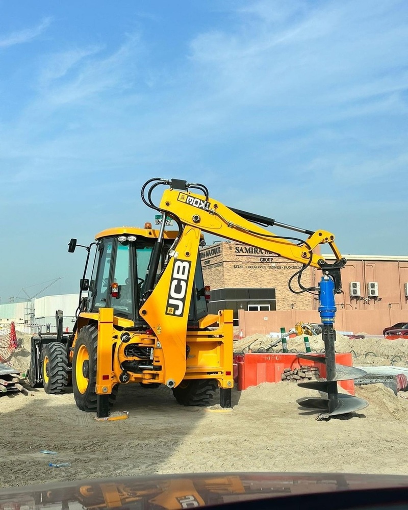 Backhoe Loader Mounted Earth Drilling Auger - Color: Yellow