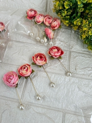 Rose brooches