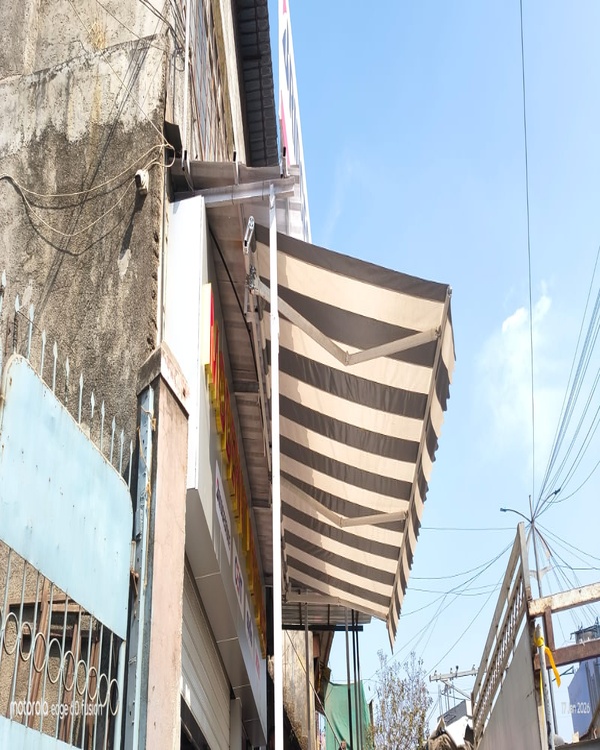 Shop front retractable awning
