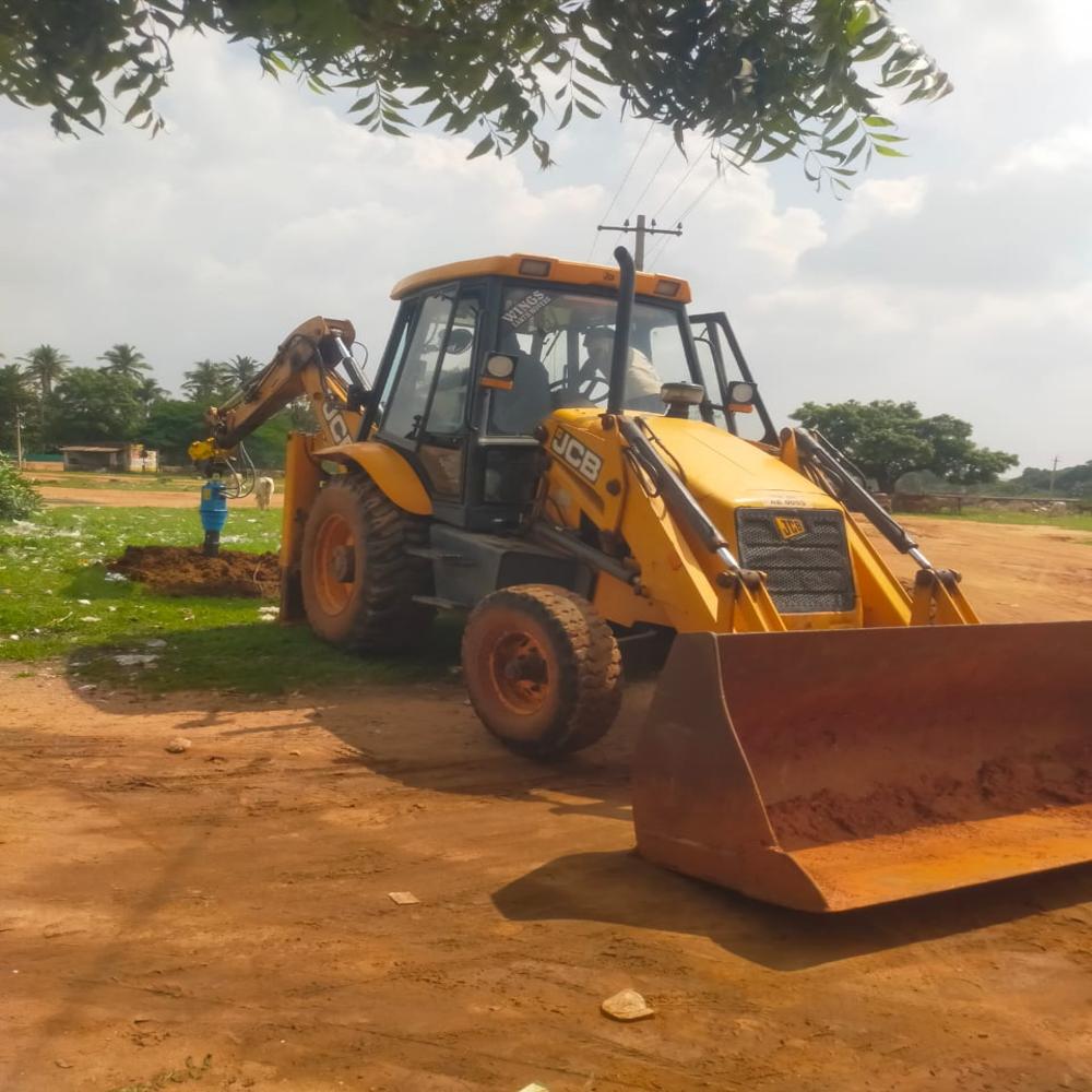 Backhoe Loader Mounted Earth Drilling Auger - Color: Yellow