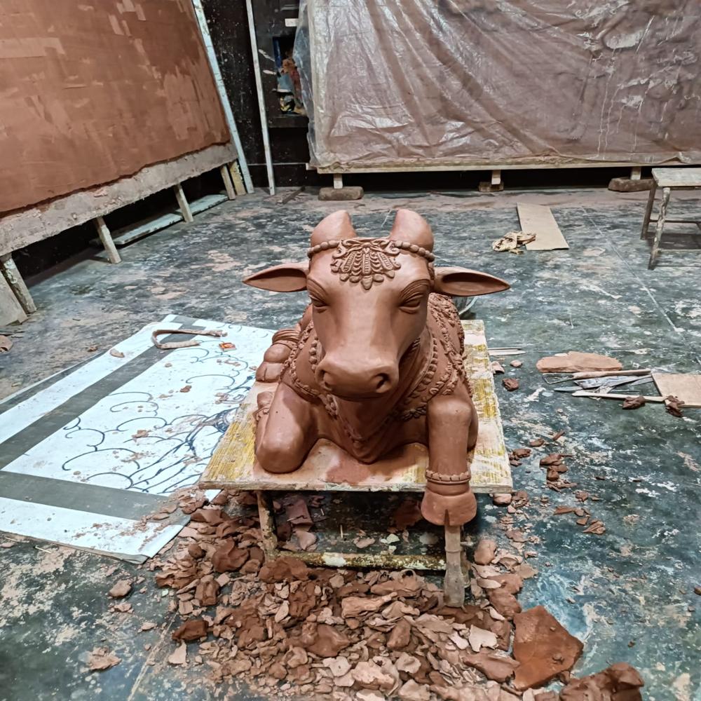 FRP Bull sitting sculpture