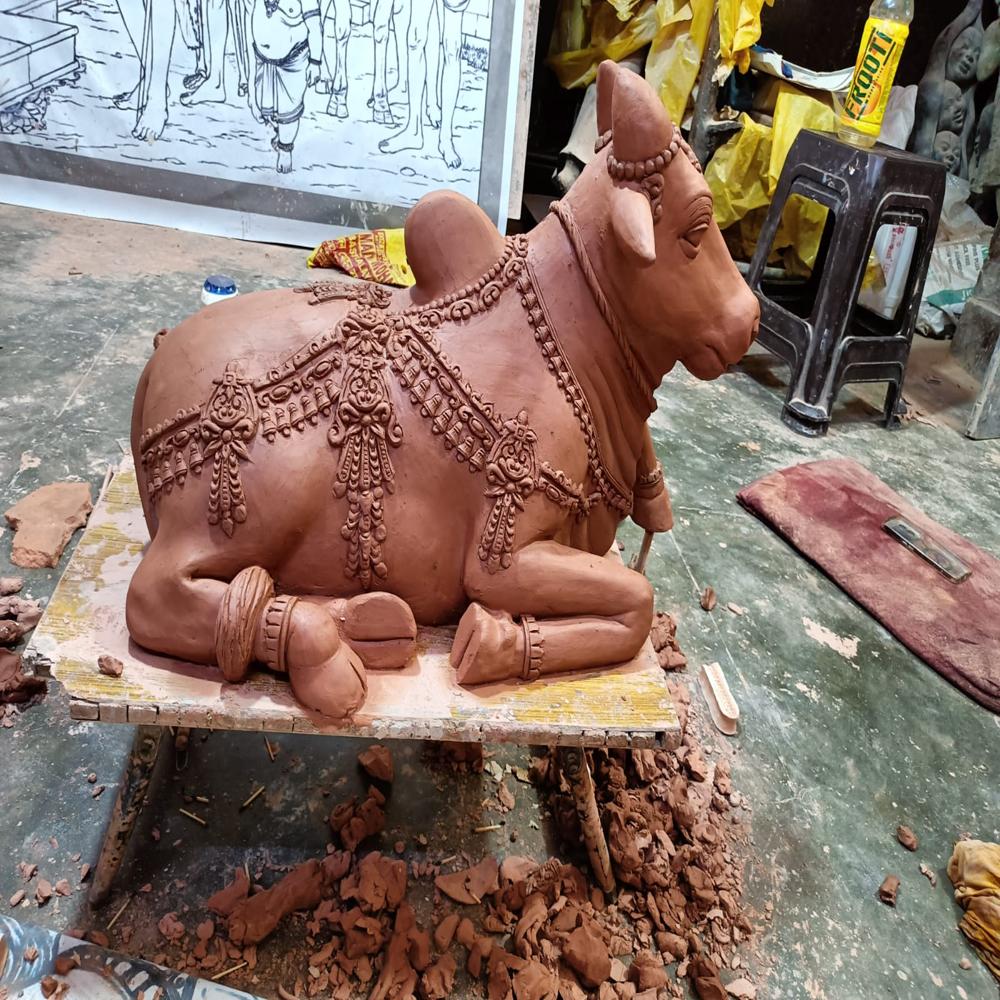 FRP Bull sitting sculpture