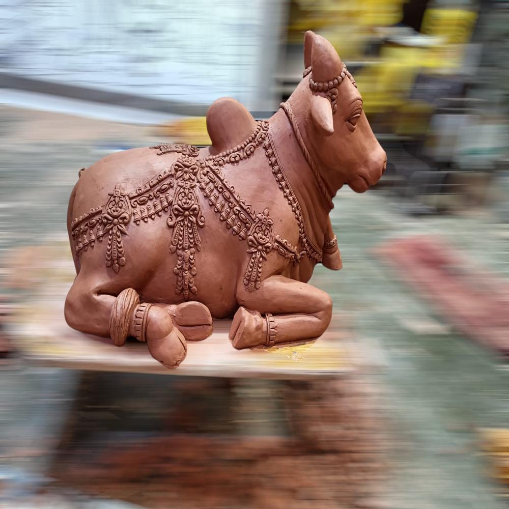 FRP Bull sitting sculpture