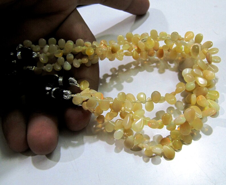 Ethiopian Opal Golden Beads, Flat Drop Smooth Beads Size 4x6mm to 6x9mm, Strand 8 inch Long with approx. 70 beads per strand