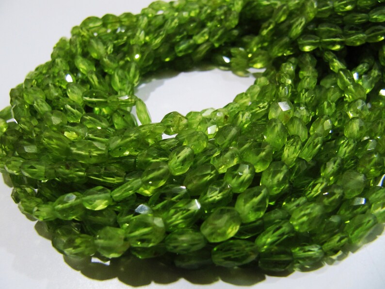 Faceted Peridot Beads: Natural Oval Gemstone Strand (3x5mm to 4x6mm)