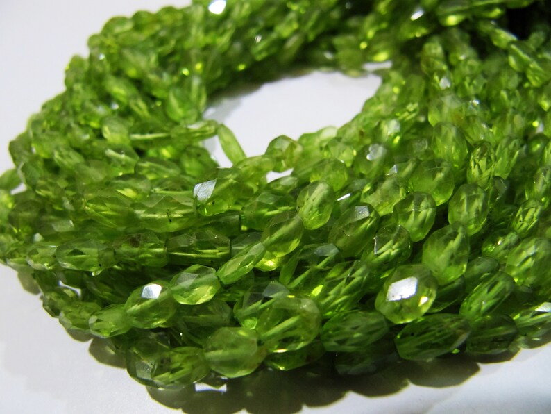 Faceted Peridot Beads: Natural Oval Gemstone Strand (3x5mm to 4x6mm)