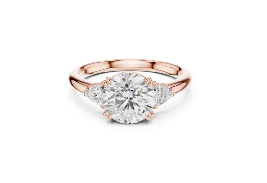 Rose Gold Oval Cut Diamond Ring with Trillion Side Stones