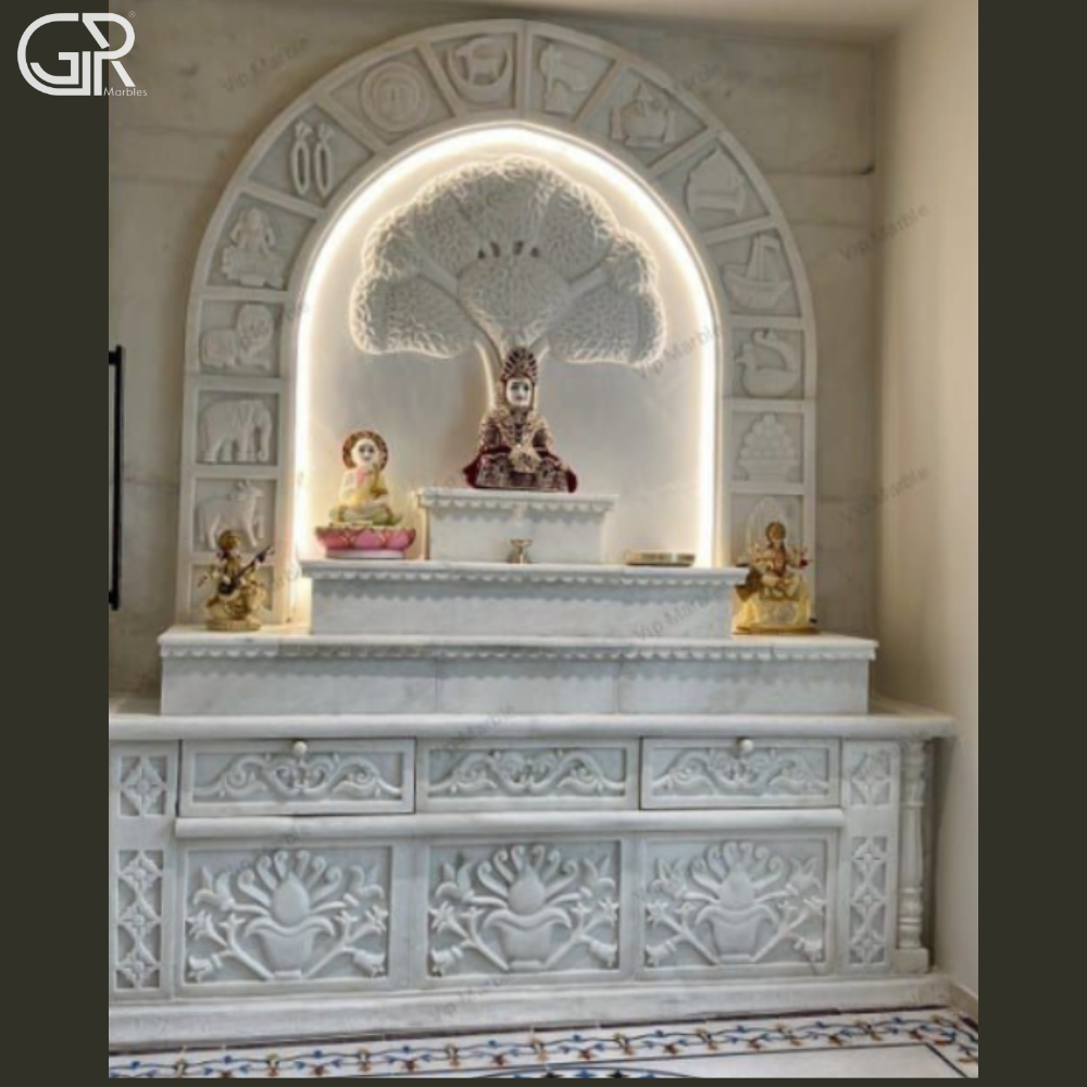 Carved marble mandir with Ganesha statue
