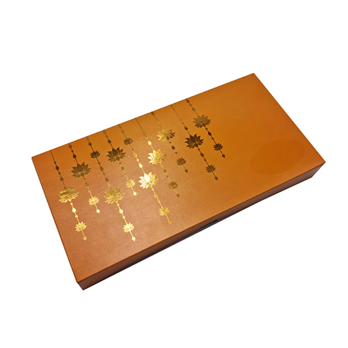 18 Cavity Premade Chocolate Box With Golden Embossed Lotus Hanging Designs In Pearl Deep Saffron