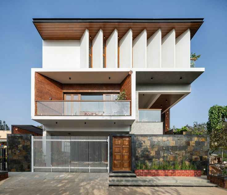 Modern Minimalist Villa Exterior Design with Balcony Garden
