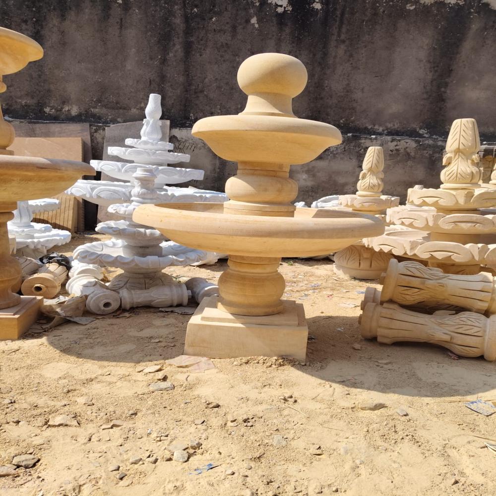 Yellow stone outdoor water fountain