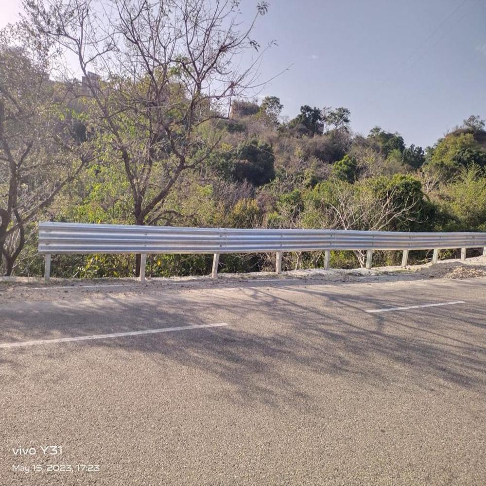 W- beam metal crash barrier