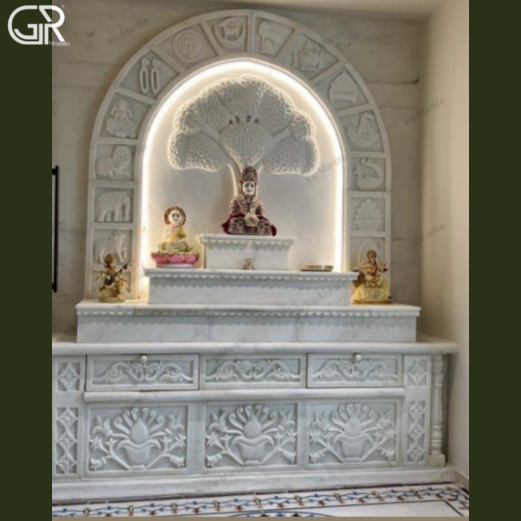 Carved marble mandir with Ganesha statue