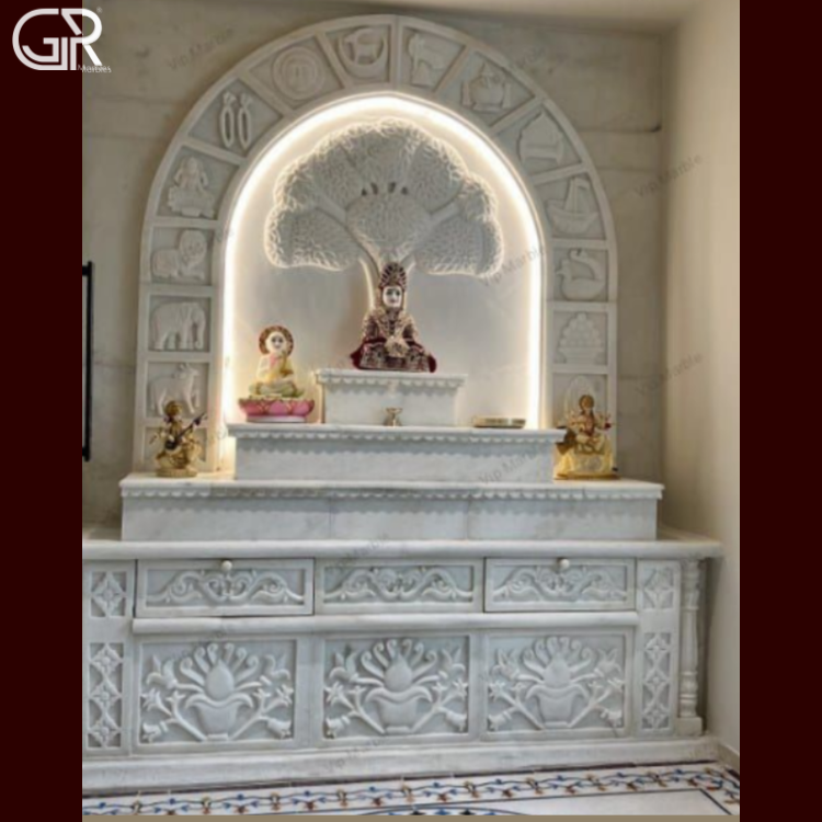 Carved marble mandir with Ganesha statue