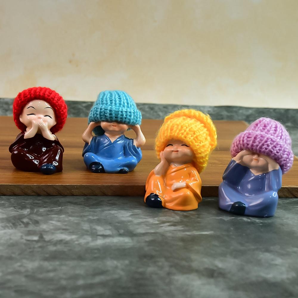 Decorative Resin Monk Buddha Showpiece Set Of 4 With Traditional Straw Hats - Color: Mix