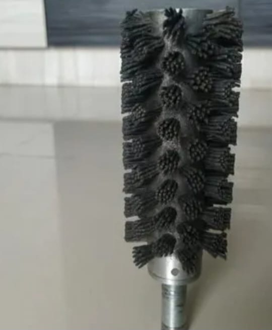 stiff tube or pipe cleaning brush