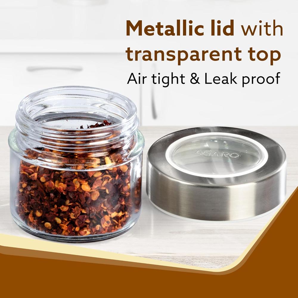 AGARO Elegant Glass Spice Jar with Metal Stand, Pack of 4, 100Ml Each, Spice storage box, kitchen organizer, spice containers, masala box for kitchen, Steel lid with transparent plastic, Transparent  34059