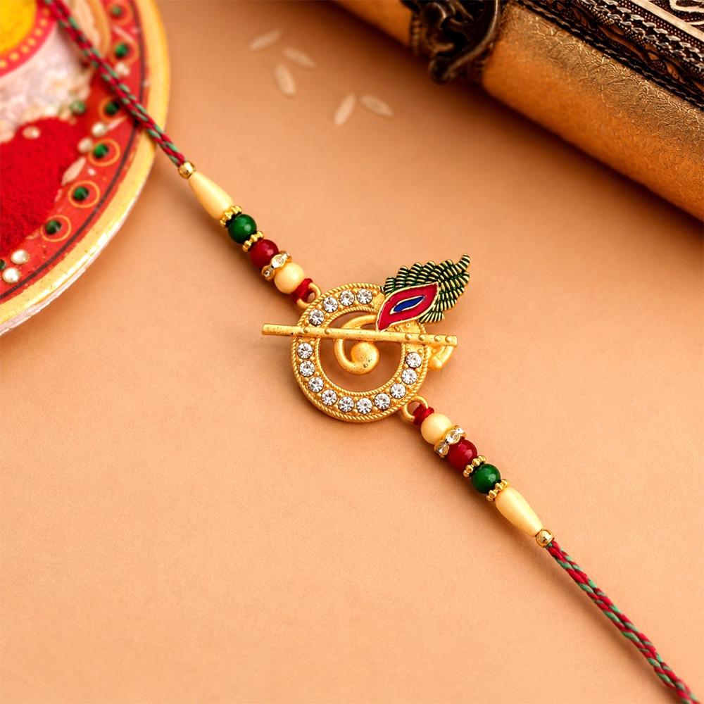 Krishna Flute Rakhi Stone Studded Peacock Feather Design - Color: Mix