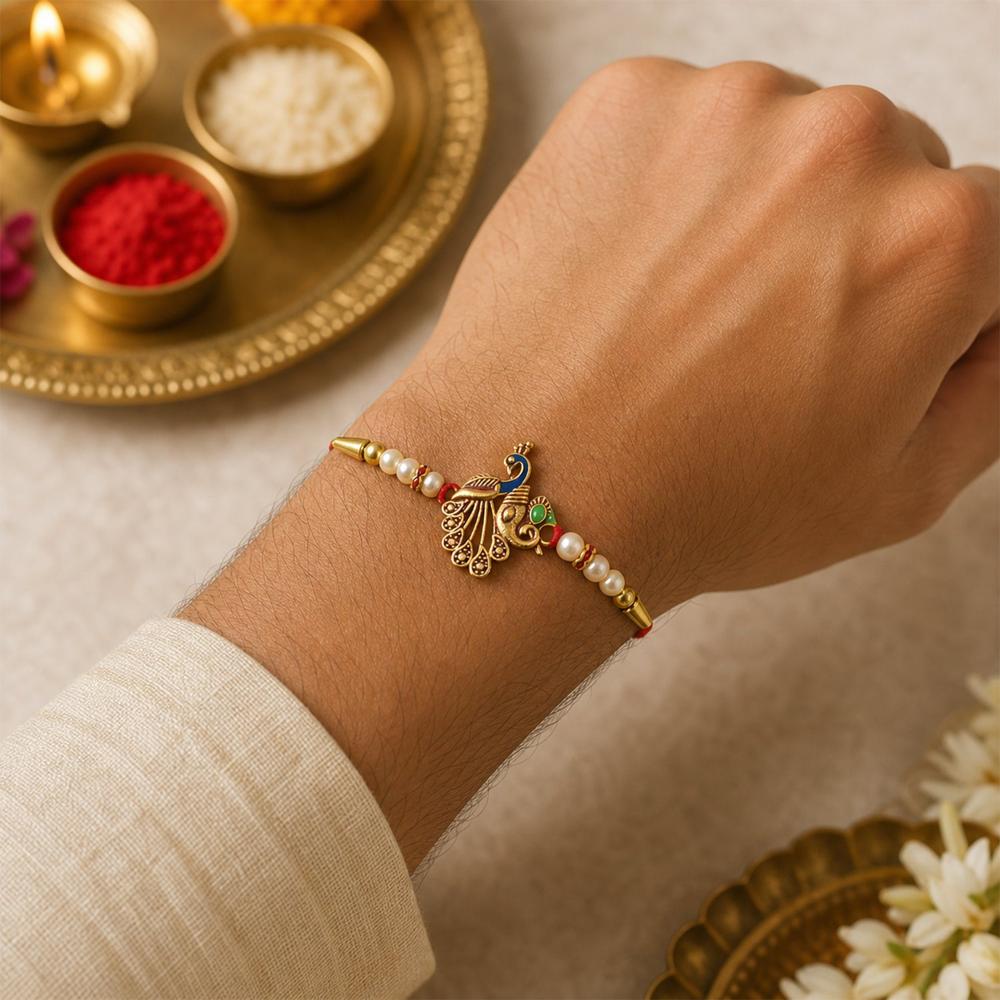 Shop Peacock Design Rakhi with Pearl Beads & Golden Detailing