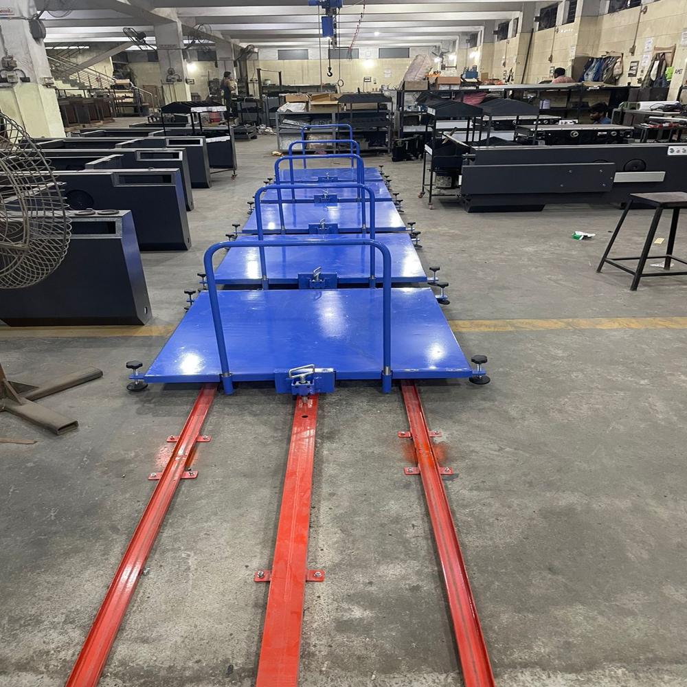 MANUAL TOW LINE FLOOR CONVEYOR SYSTEM