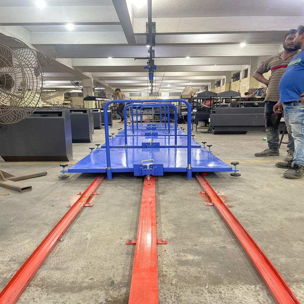 MANUAL TOW LINE FLOOR CONVEYOR SYSTEM