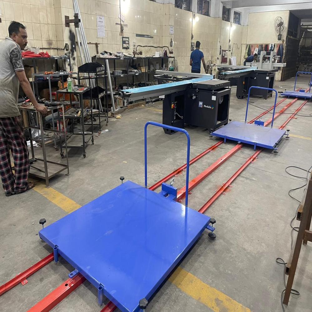 MANUAL TOW LINE FLOOR CONVEYOR SYSTEM