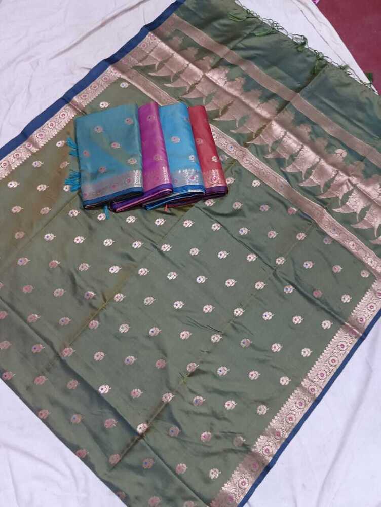 Kanchivaram style saree with small buti and thin zari border