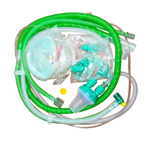 Neonatal heated wire circuit with water trap, monitor line, auto-fill chamber and limb