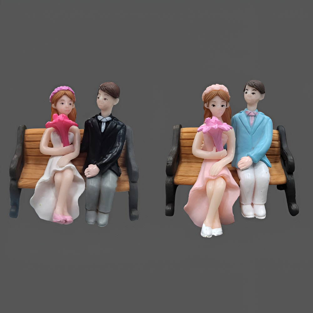 Miniature Couple Sitting On Chair