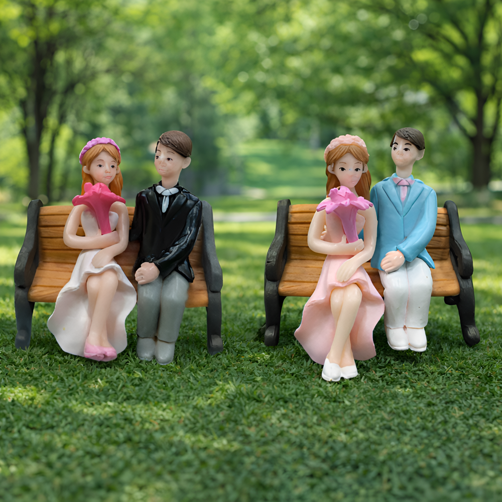 Miniature Couple Sitting On Chair