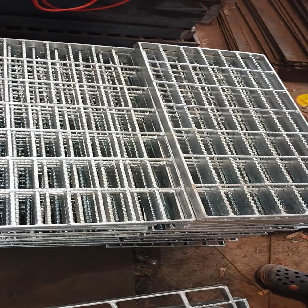 Swage locked grating