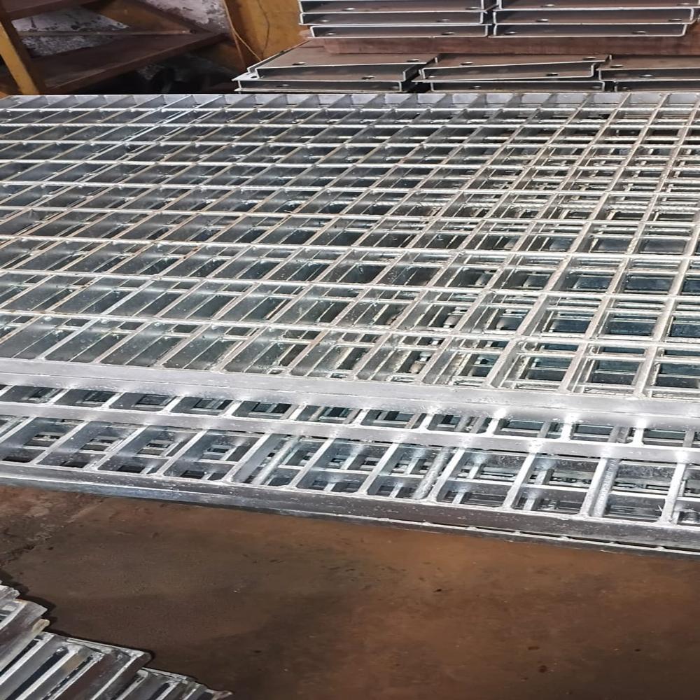 Swage locked grating