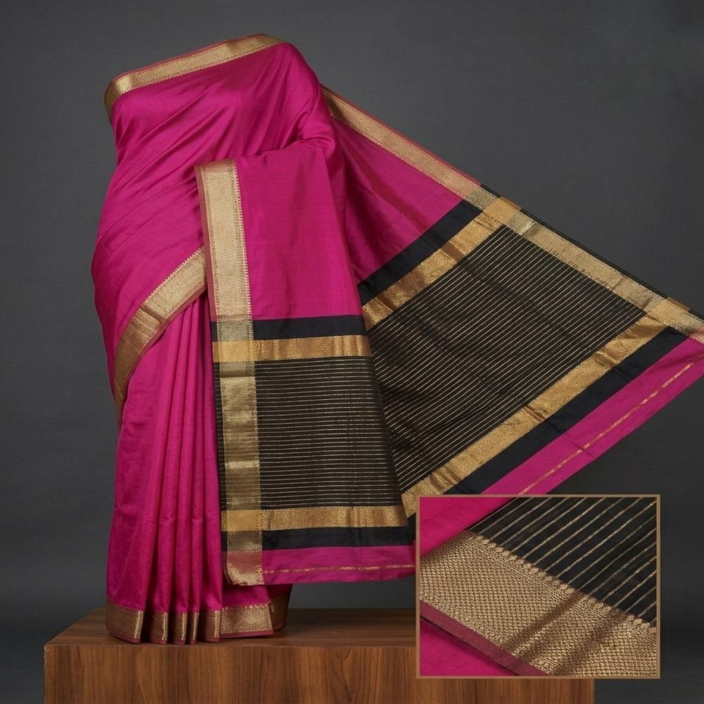 Banarasi cotton silk with antique floral zari border and striped pallu.
