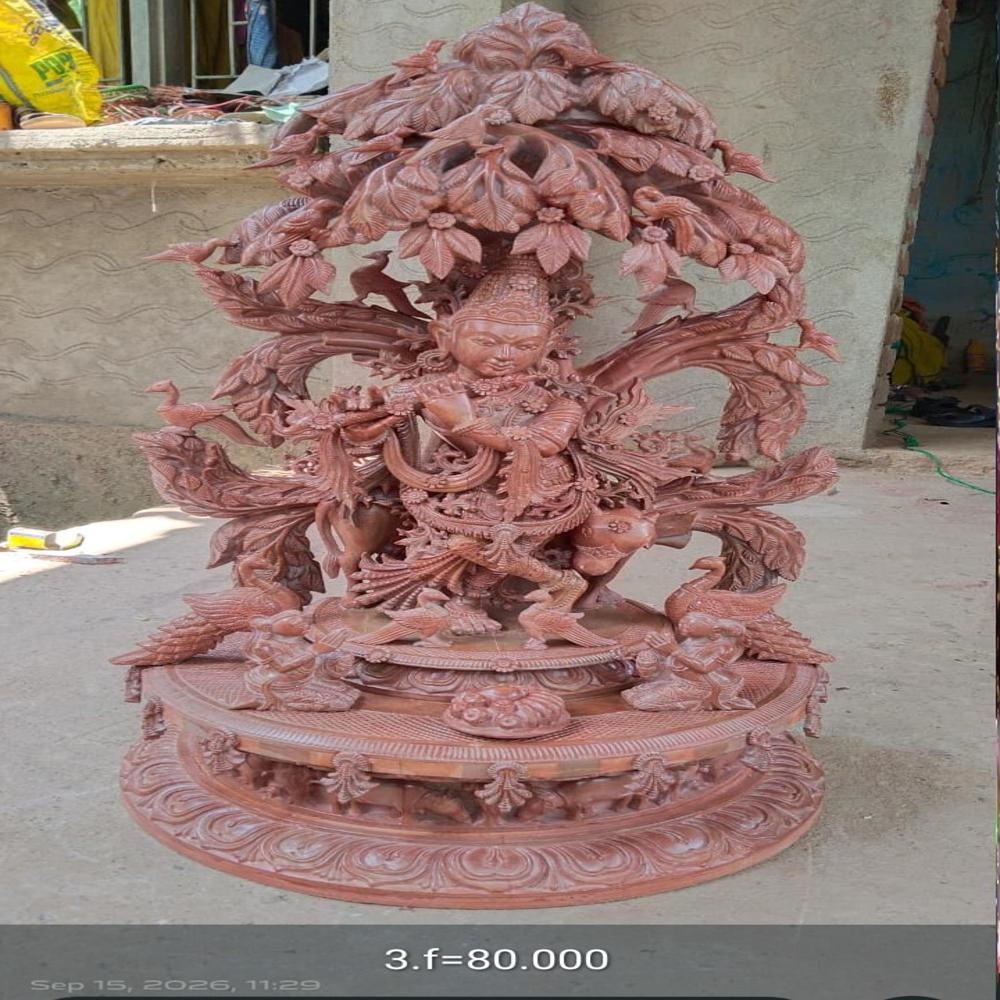 Hand carved pink stone Krishna status