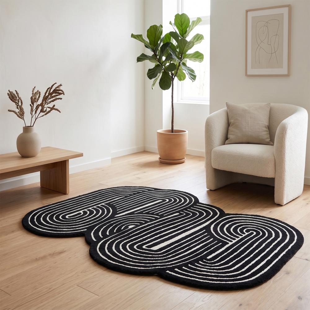 Handmade Black and Ivory Abstract Braided Rug with Unique Sculptural Loop Pattern for Modern Living Room Decor