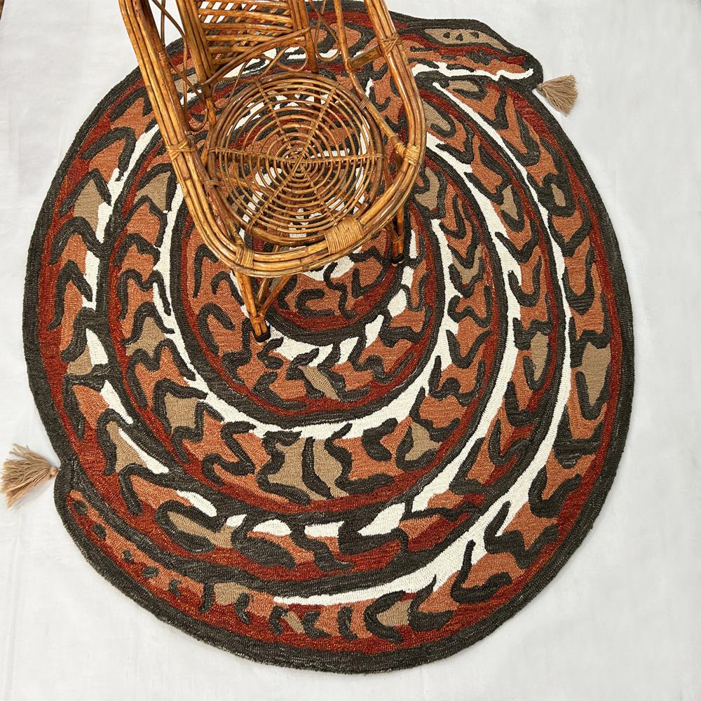 Handmade Oval Snake Pattern Tufted Rug In Rust Orange Black Beige And Cream With Decorative Tassels - Color: All