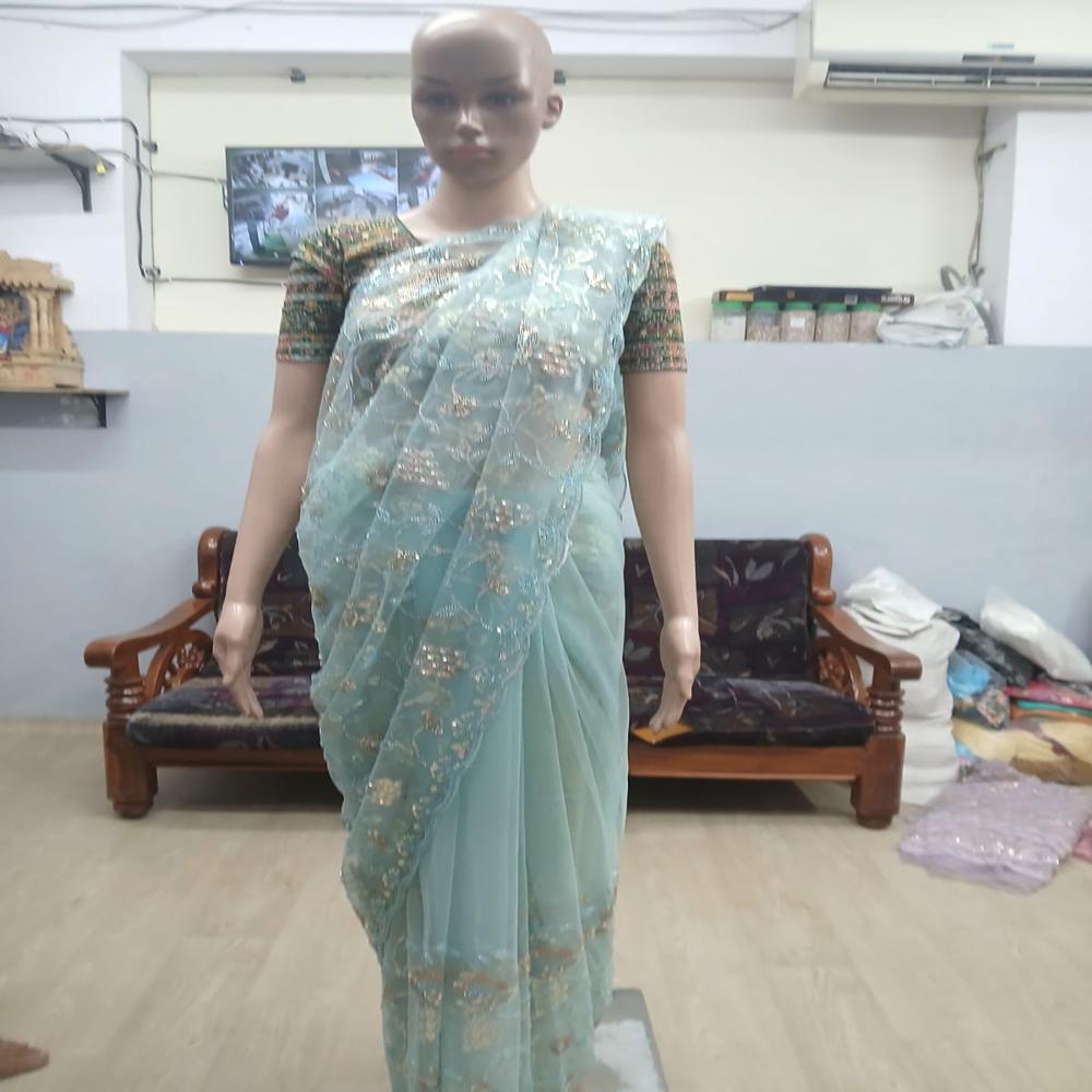 Elegant Sky Blue Embroidered Net Saree with Shimmering Floral Work