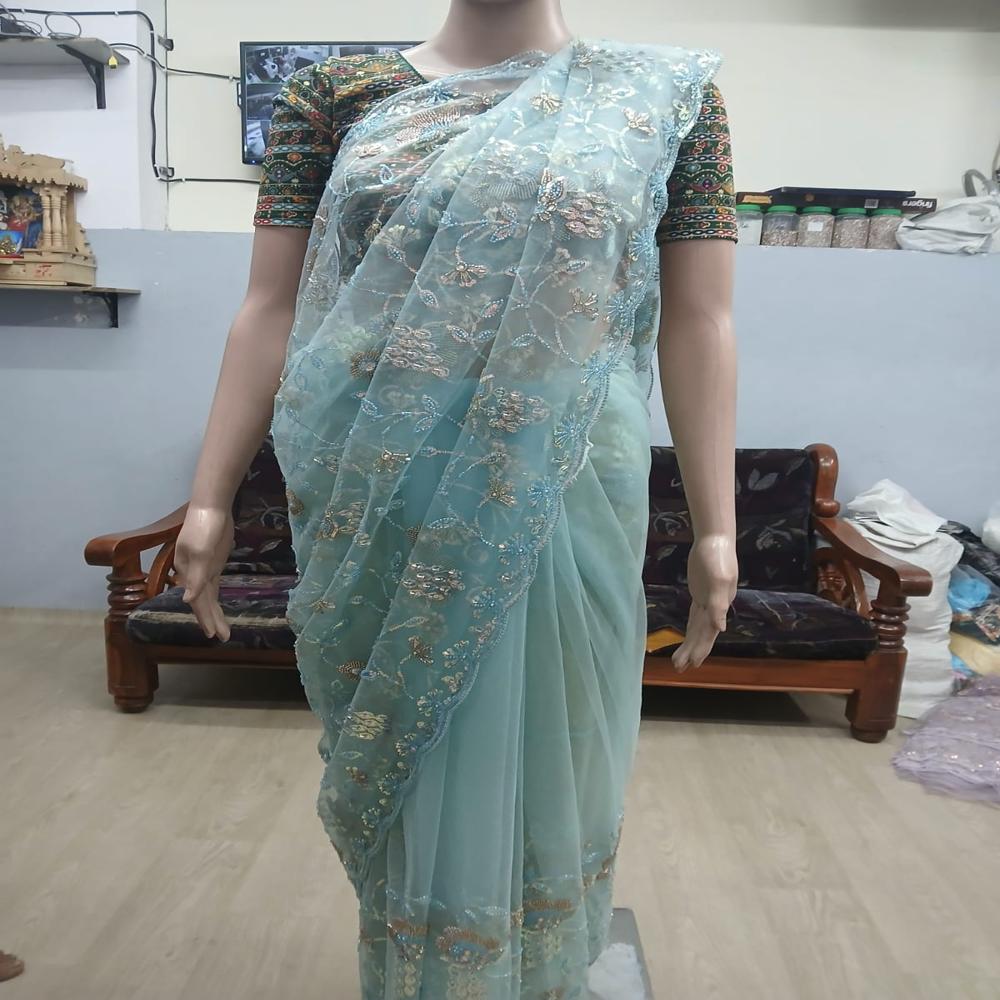 Elegant Sky Blue Embroidered Net Saree with Shimmering Floral Work