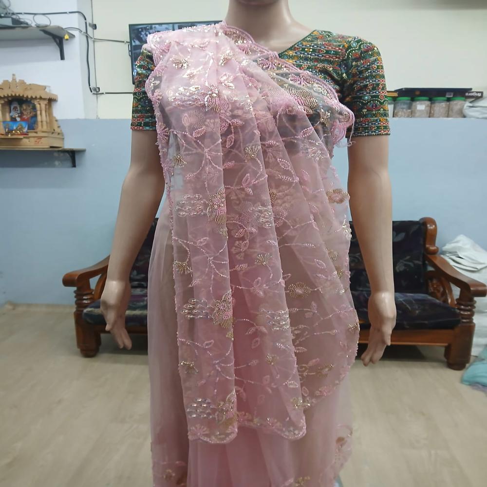 Elegant Blush Pink Embroidered Net Saree with Shimmering Floral Work
