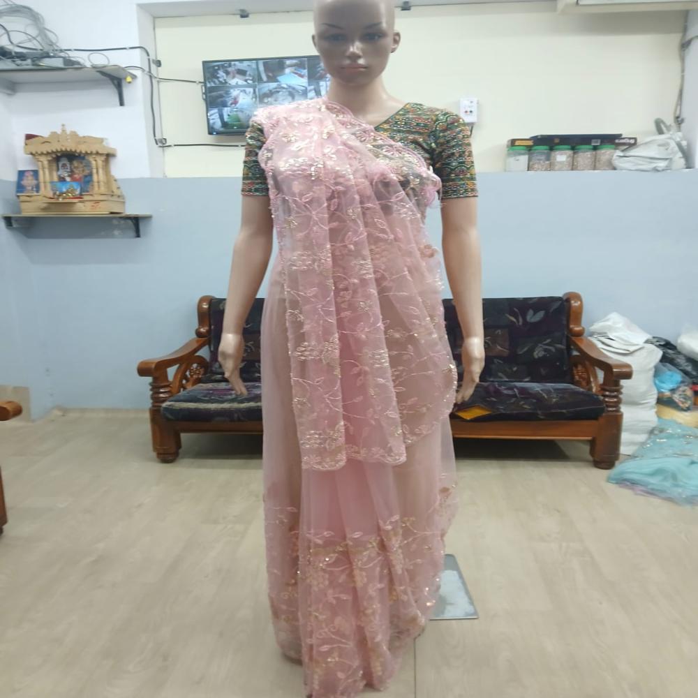 Elegant Blush Pink Embroidered Net Saree with Shimmering Floral Work