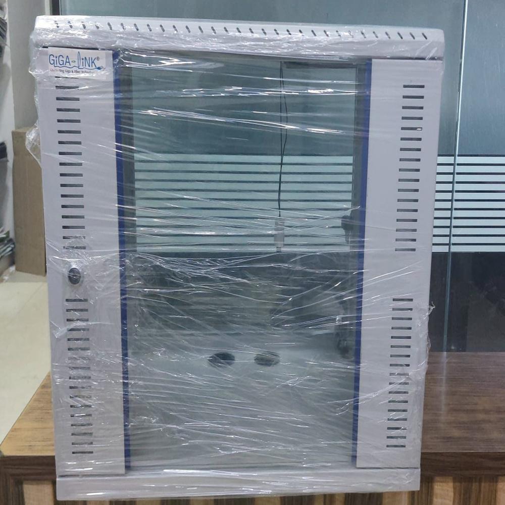 Gigalink "Wall Mount 6U 550W X 450D Front Glass Door (Toughened) With Lock & Key Cooling Fan / 90 Cfm /230V Ac (1 No)" 1U Cable Manager (1) Hardware Packet (1 Pkt) 6 Socket 5 (1 Pkt) 6 Socket 5 Amp. Power Distribution Unit (1 No) - Capacity: 40 Kg