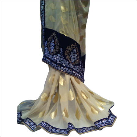 क्रीम साड़ी नीली किनारी