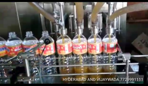 Silver Automatic Liquid Filling Machine