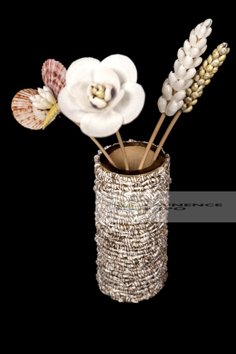Handicraft seashell vase with decorative flowers