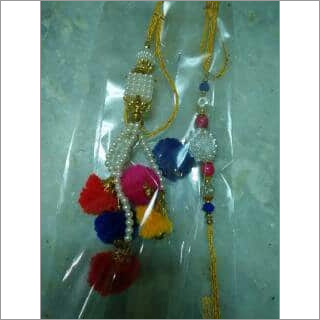 हस्तनिर्मित डिज़ाइनर राखी और लुंबा सेट