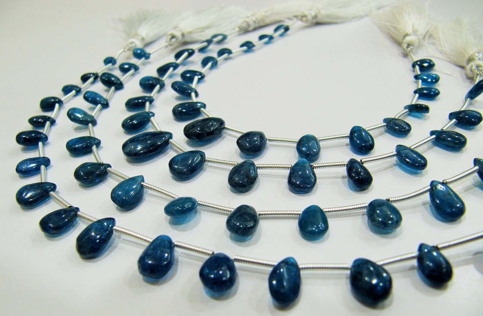 Aaa Quality Natural Neon Apatite Briolette Beads - 4x6mm To 5x7mm, Blue Pear Shape Plain Smooth Strand 8 Inches Long