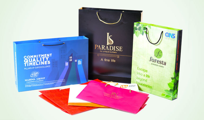Designer Printed Bags - Paperboard, Variable Dimensions, Green | Customizable Full-color Prints, Durable, Eco-friendly, Twisted Paper Handles